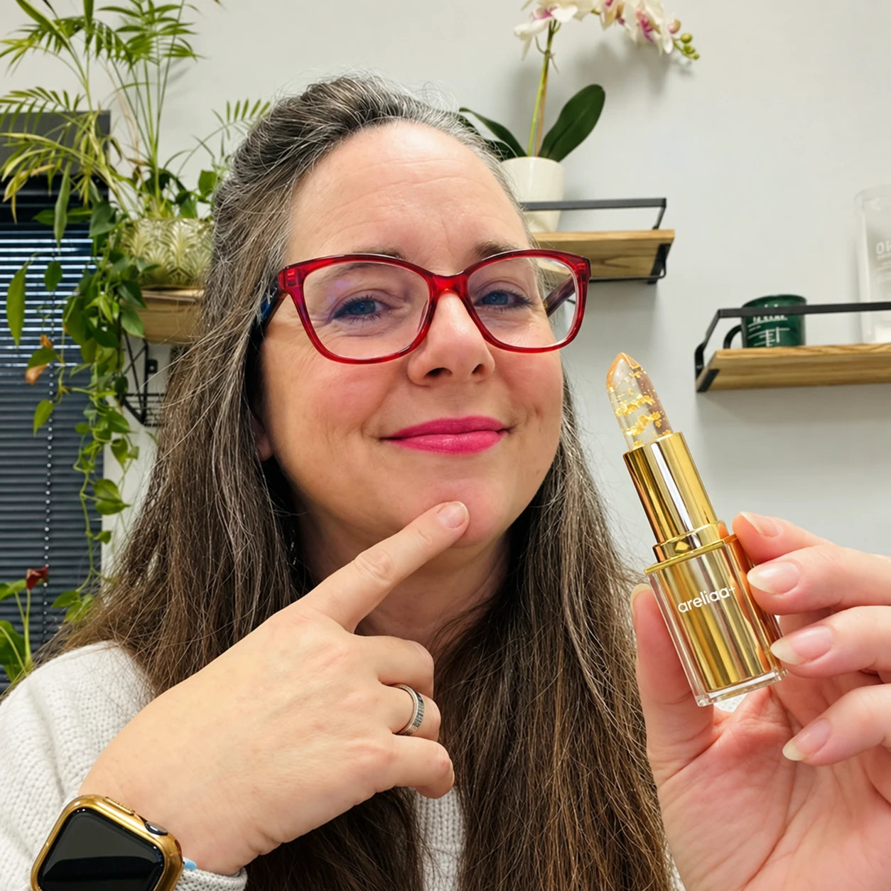 Woman holding areliaa+ Signature Lipstick
